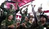 Лидер народа: больше, чем отец (Female Libyan supporters of Gaddai celebrate after graduation in weapons training and pose for forei…) Female Libyan suppor…