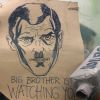 Большой Брат, помоги. Facebook попросил государство регулировать интернет (Участница акции протеста с плакатом Большой Брат следит за тобой | © AFP 2019 / Filippo Monteforte) Участница акции прот…